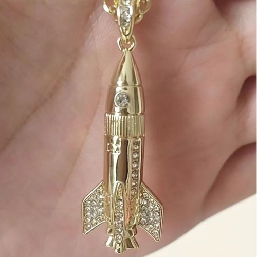 Fully pavé-set astronaut and rocket necklace