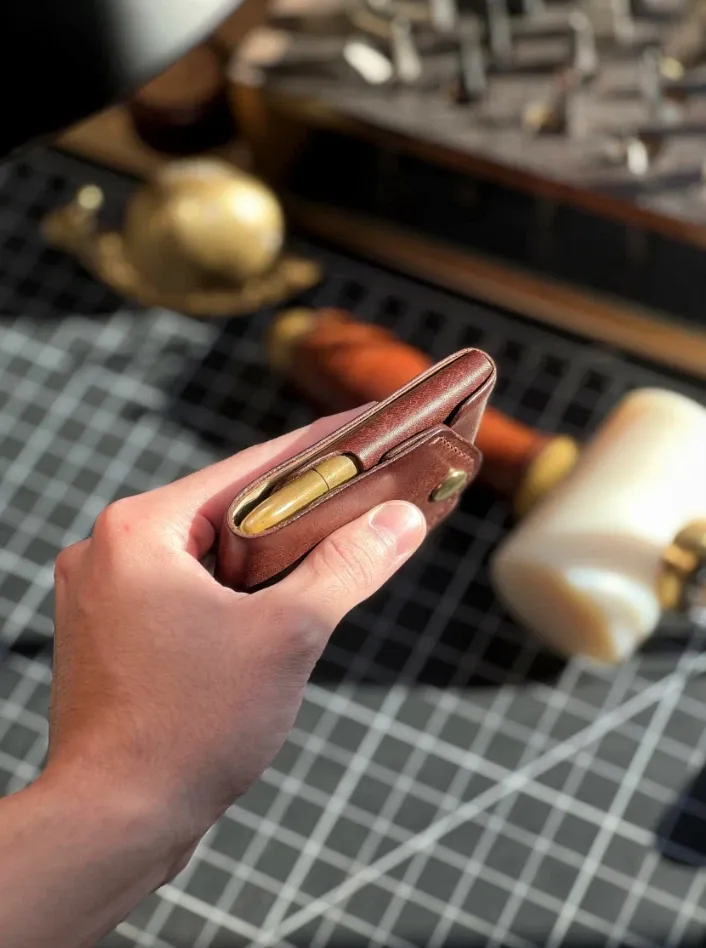 The Conan Wallet, a compact, multifunctional wallet, a slim minimalist men's wallet, a men's travel wallet with a pen holder, and a handmade leather wallet.