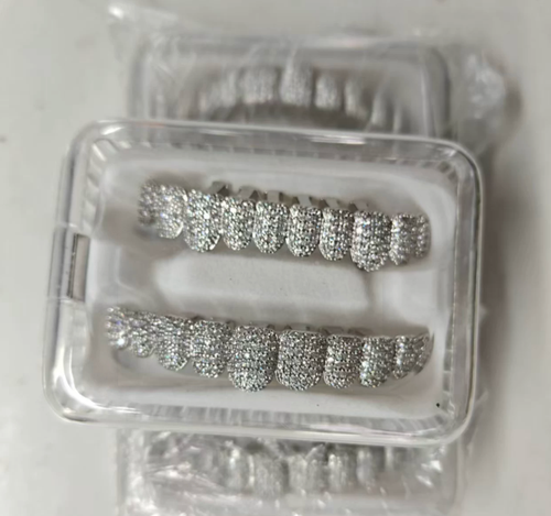 Hip-hop 10-tooth grillz: 18K gold-plated copper set with cubic zirconia—ideal for rap parties.