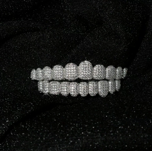 Hip-hop 10-tooth grillz: 18K gold-plated copper set with cubic zirconia—ideal for rap parties.