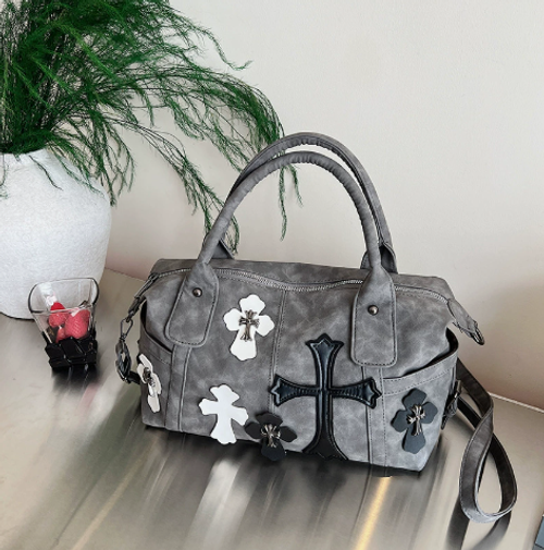 Black-and-white color-block travel tote featuring a cross design a spacious, minimalist large bag suitable for commuting, designed for shoulder or crossbody carry.