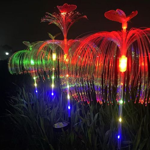 Solarpowered automatic charging garden light with stainless steel ground stake features automatic colorchanging capabilities and zero electricity consumptionideal for courtyards and lawns.