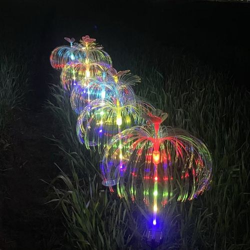 Solarpowered automatic charging garden light with stainless steel ground stake features automatic colorchanging capabilities and zero electricity consumptionideal for courtyards and lawns.