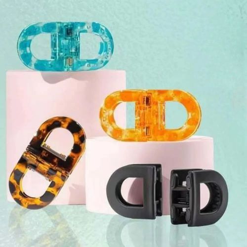Magnetic hair clips, featuring four different color options, suitable for various styling styles.