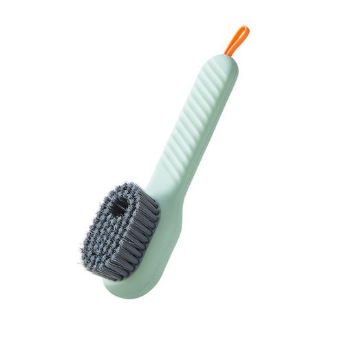 Multi-functional liquid-dispensing shoe brush, a household tool for pressing to dispense liquid and clean shoes