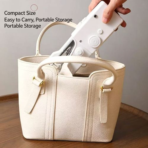 Portable handheld mini sewing machine for home use – simple, compact, and pocket-sized.