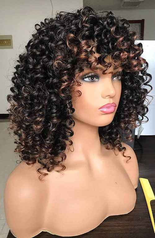 Highlighted short curly wig with bangs, featuring a voluminous, loosely curled style.