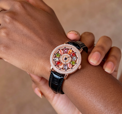 Ladies' watch with rotating dial and colored simulated diamonds