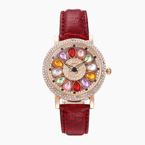 Ladies' watch with rotating dial and colored simulated diamonds