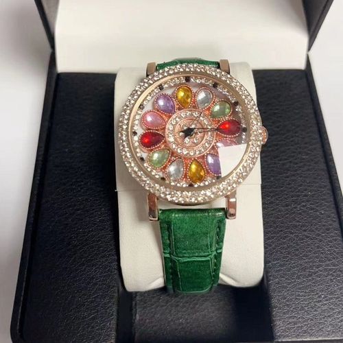 Ladies' watch with rotating dial and colored simulated diamonds