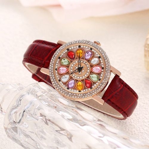 Ladies' watch with rotating dial and colored simulated diamonds