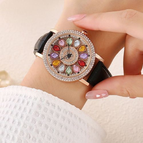 Ladies' watch with rotating dial and colored simulated diamonds