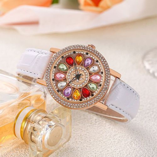 Ladies' watch with rotating dial and colored simulated diamonds