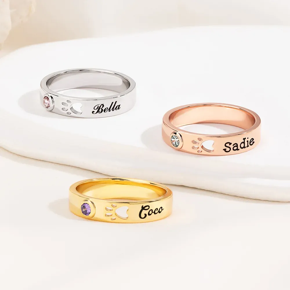 Personalized rings with openwork paw prints, can be engraved with names and birthstones, pet keepsake jewelry, birthday or funeral gifts, perfect for animal lovers.
