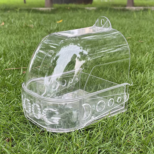 A cage for bathing and feeding parrots.