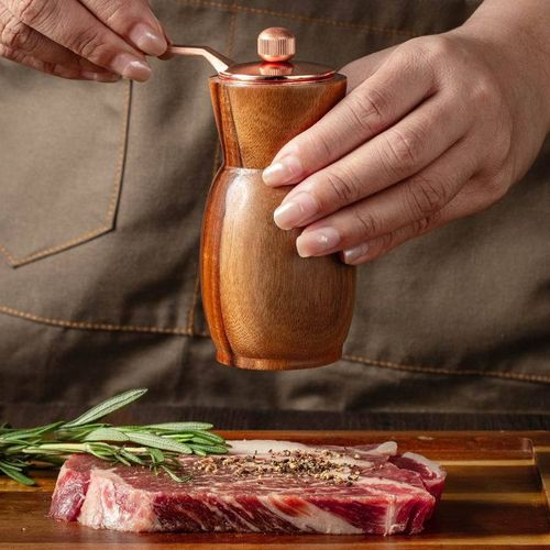 Hand-operated acacia pepper grinder
