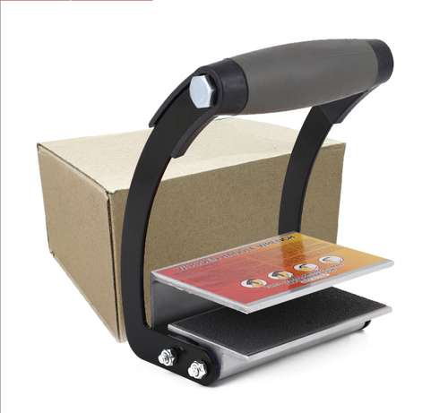 Labor-saving tile carrying handleclamp—an essential tool for tile and wood panel installers.