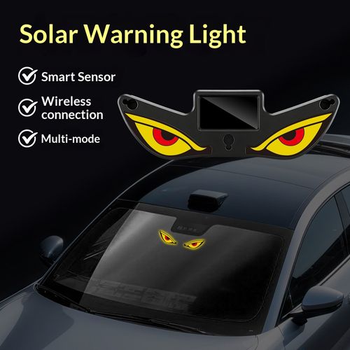 Solar-powered decorative warning light with blinking animated eyes