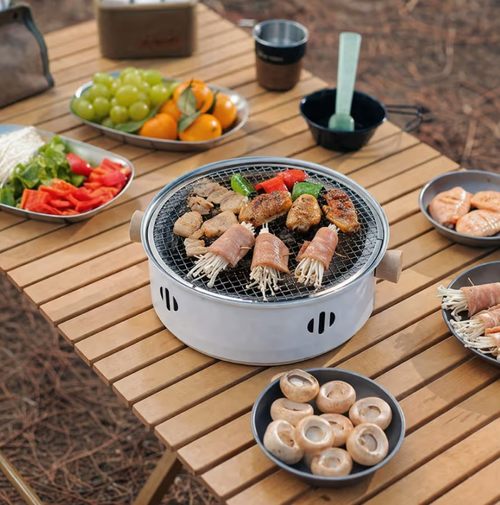 Compact, portable, multifunctional ea-brewing-by-the-fire stove—suitable for heating and grilling, compatible with both electric and charcoal power sources.