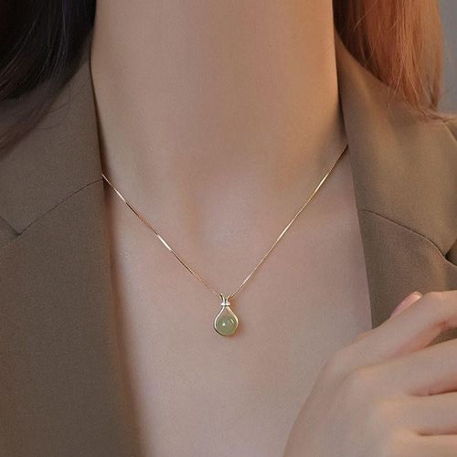 The women's titanium steel necklace with a light luxury style imitating the Hetian jade blessing bag pendant exudes a sense of high-end elegance and simplicity, and is versatile A piece of jewelry