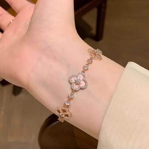 Luxury 2025 women's titanium bracelet, gilded retro style, four-petal pink crystal inlaid hollow adjustable length bracelet