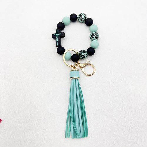 Leopard print tassel cross-shaped beaded keychain, stylish and cute jewelry, unisex, fashionable accessory, the perfect gift for a friend.