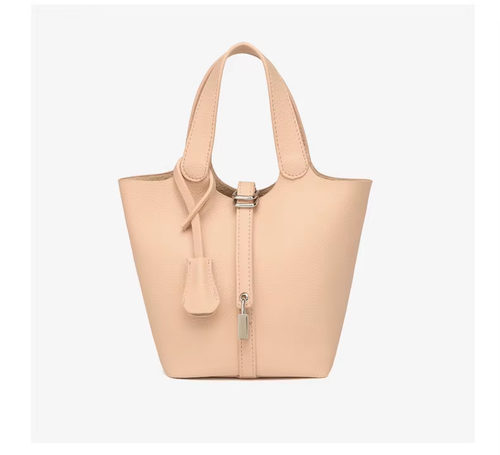 This stylish women's leather handbag blends elegance and practicality. Spacious inside, fits daily essentials. Perfect for work or dates—adds charm to any outfit.