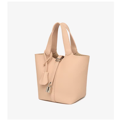 This stylish women's leather handbag blends elegance and practicality. Spacious inside, fits daily essentials. Perfect for work or dates—adds charm to any outfit.