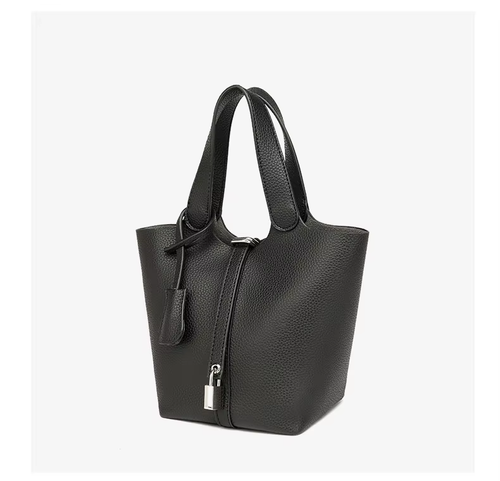 This stylish women's leather handbag blends elegance and practicality. Spacious inside, fits daily essentials. Perfect for work or dates—adds charm to any outfit.