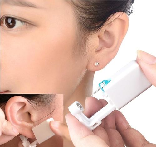 Disposable automatic ear piercer
