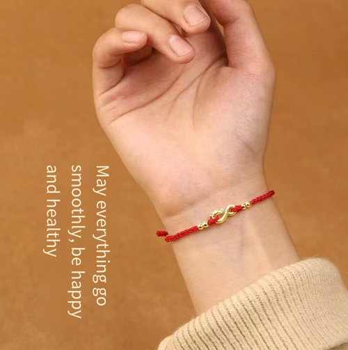 This red rope bracelet is meticulously crafted using traditional techniques. The golden dragon pendant depicts the dragon diving into the deep sea, while the golden beads add a touch of elegance. If you place an order today, you will receive a total of four products - four ancient-style red rope woven bracelets (in red, wine red, black, and green). This is a gentle and lucky item, suitable for personal collection or as a gift.