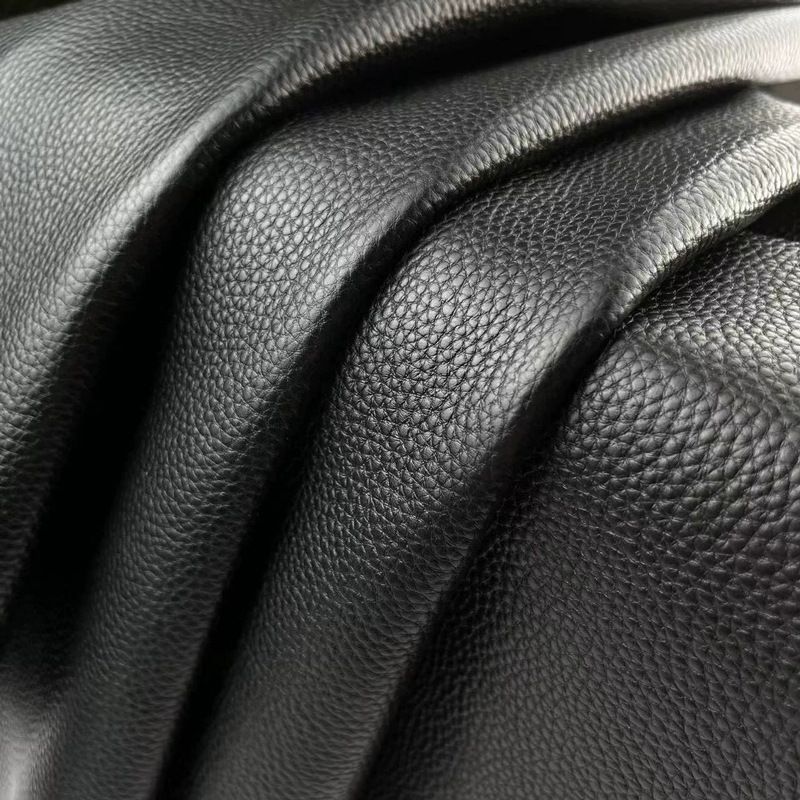 Black lychee-patterned top-grain cowhide with clear and textured patterns. Handmade leather goods such as bags, shoes, and other materials are durable. Leather of high quality.