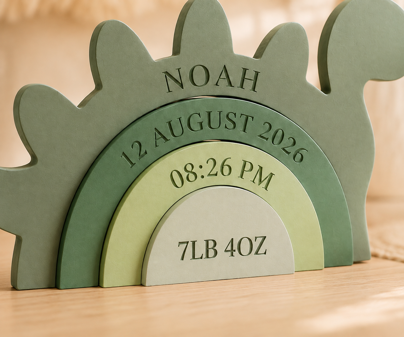 Close-up of personalized dinosaur birth details