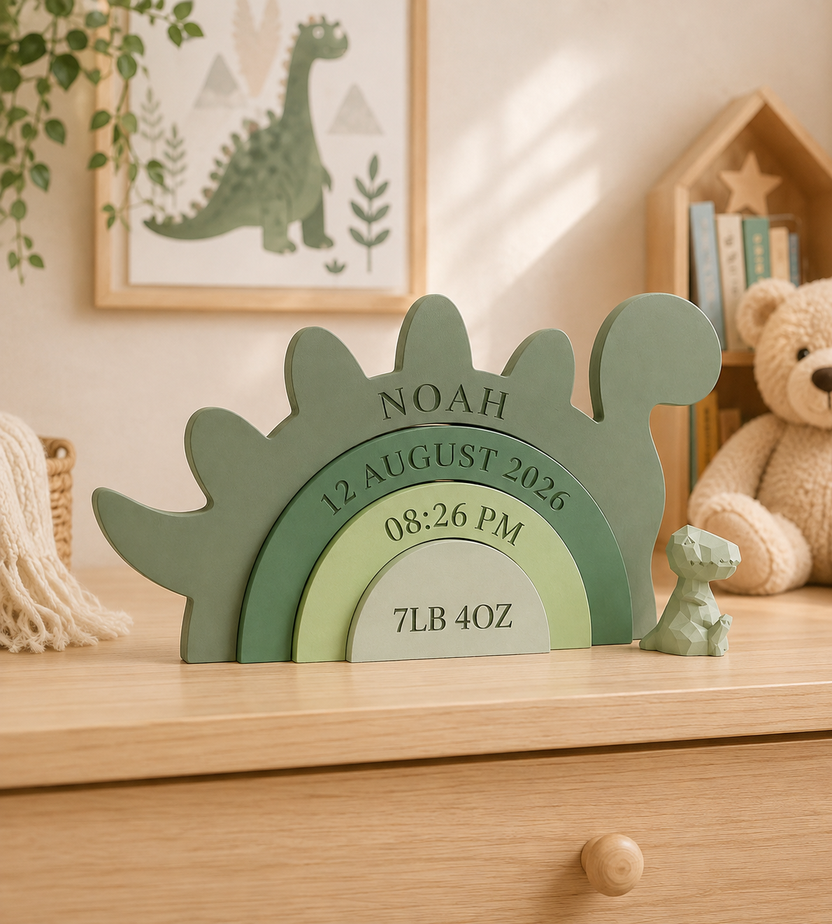 Personalized dinosaur baby birth keepsake displayed in nursery
