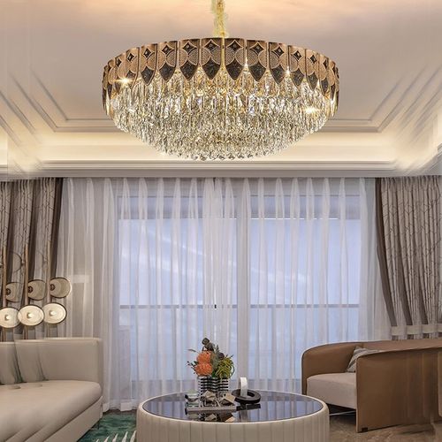 This light luxury crystal chandelier features a high-end gold lamp body paired with layered brilliant crystal design, with a magnificent and atmospheric overall shape. When lit up, it reflects a crystal clear and transparent lighting effect, easily enhancing the level of home space. Whether installed in the living room, bedroom, dining room, or hotel apartment, it can create a warm, elegant, and luxurious atmosphere.