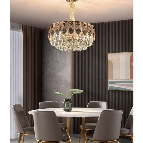 This light luxury crystal chandelier features a high-end gold lamp body paired with layered brilliant crystal design, with a magnificent and atmospheric overall shape. When lit up, it reflects a crystal clear and transparent lighting effect, easily enhancing the level of home space. Whether installed in the living room, bedroom, dining room, or hotel apartment, it can create a warm, elegant, and luxurious atmosphere.