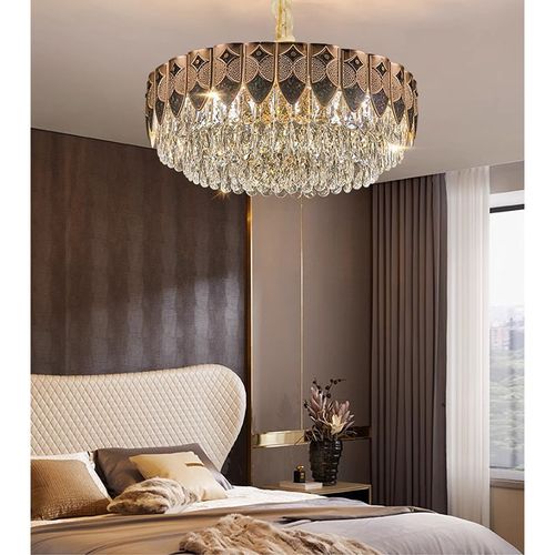 This light luxury crystal chandelier features a high-end gold lamp body paired with layered brilliant crystal design, with a magnificent and atmospheric overall shape. When lit up, it reflects a crystal clear and transparent lighting effect, easily enhancing the level of home space. Whether installed in the living room, bedroom, dining room, or hotel apartment, it can create a warm, elegant, and luxurious atmosphere.
