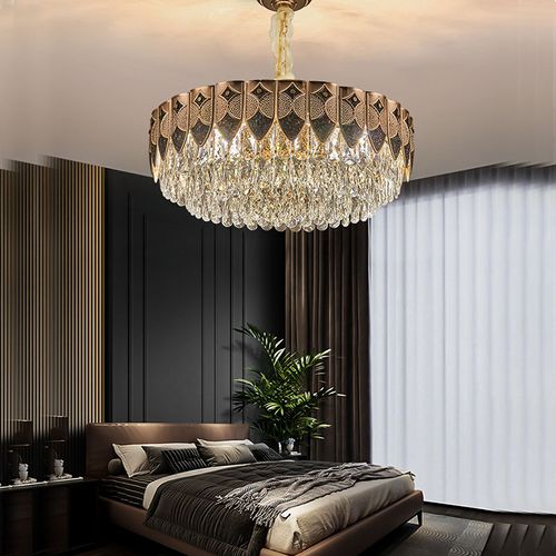 This light luxury crystal chandelier features a high-end gold lamp body paired with layered brilliant crystal design, with a magnificent and atmospheric overall shape. When lit up, it reflects a crystal clear and transparent lighting effect, easily enhancing the level of home space. Whether installed in the living room, bedroom, dining room, or hotel apartment, it can create a warm, elegant, and luxurious atmosphere.