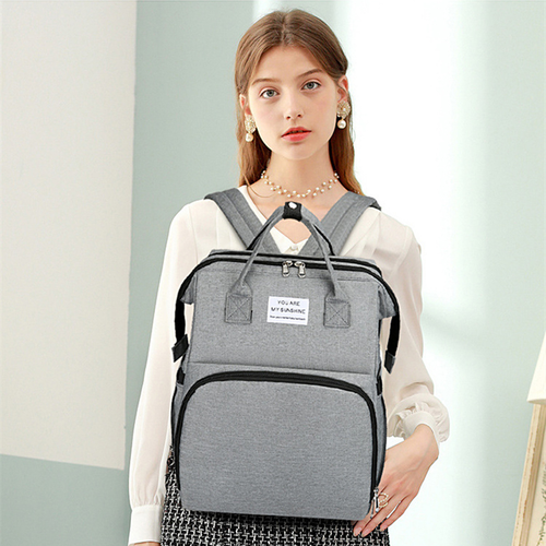 Portable folding mosquito net crib diaper bag, multi-functional, lightweight, large-capacity casual backpack for outings and babies.