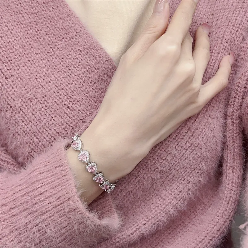 Pink heart-shaped, fully encrusted with sparkling cubic zirconia, adjustable stretch bracelet for women.