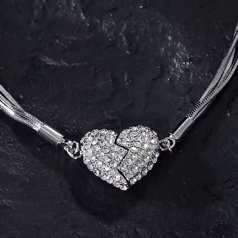 Niche design necklace with diamond-encrusted heart and magnet.