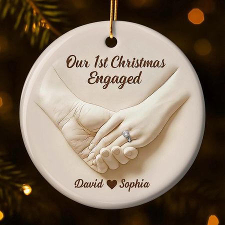 Our first Christmas after our engagement, a custom-made ceramic ornament, a gift for our engaged couple, featuring a ring on their hand.