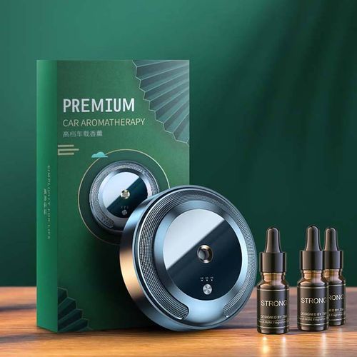 USB luxury car air freshener diffuser placed on the dashboard for dispensing perfume liquid spray