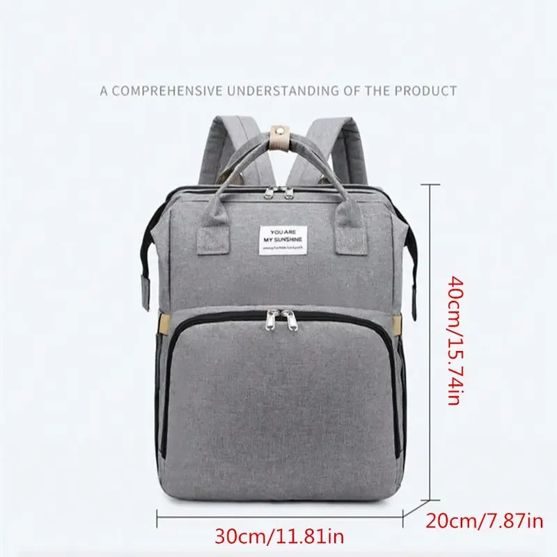 🛏️ All-in-one foldable baby crib bag with soft diaper pad for convenient care.