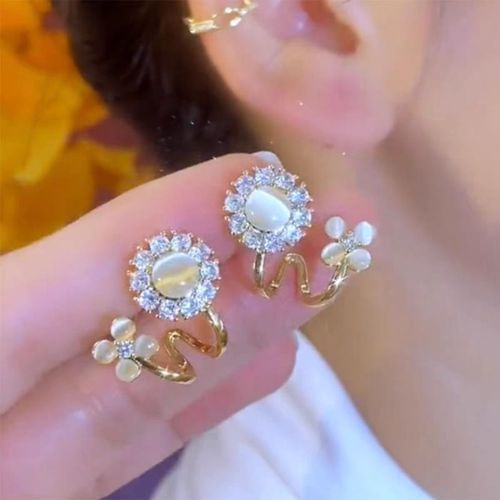 50% OFF Light Luxury Fashion High-end Simple Cat's Eye Stone Flower Alloy Earrings
