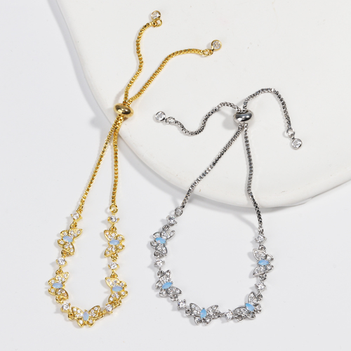 New electroplated adjustable pull-out bracelet with blue zircon and bowknot design.