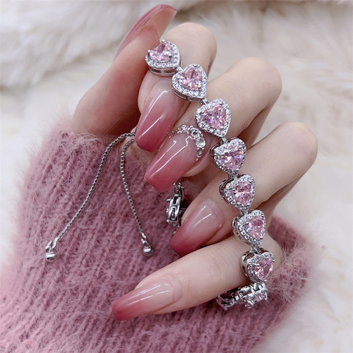 Pink heart-shaped, fully encrusted with sparkling cubic zirconia, adjustable stretch bracelet for women.