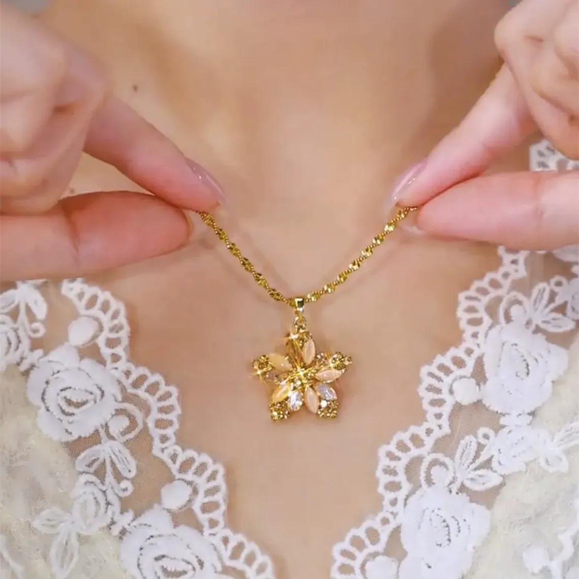 Champagne gold plated necklace with a diamond-encrusted five-pointed star and small flower pendant for women.