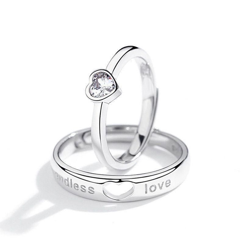 Diamond studded heart-shaped couple ring