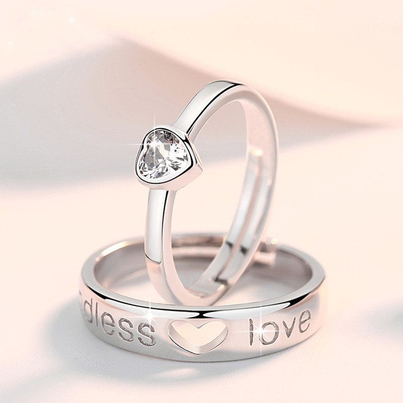 Diamond studded heart-shaped couple ring
